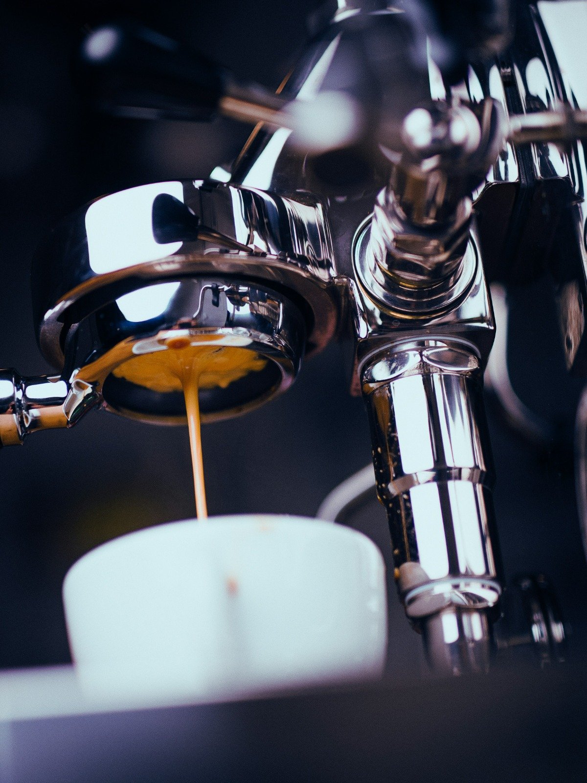 Espresso extracting from a portafilter into a cup